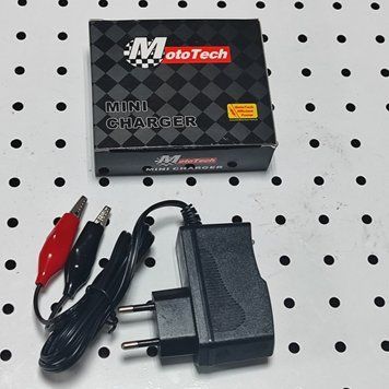 Универсальное импульсное зарядное устройство 12V к мопедам и скутерам.HONDA , SUZUKI, YAMAHA 14100041
